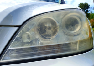 Dirty Front Headlights of a Car