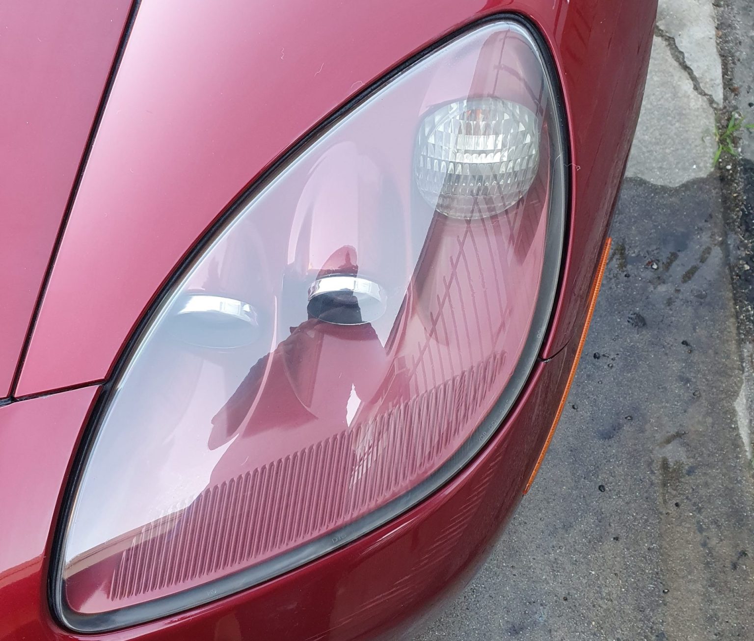 New Headlights Fixed to a Red Color Car