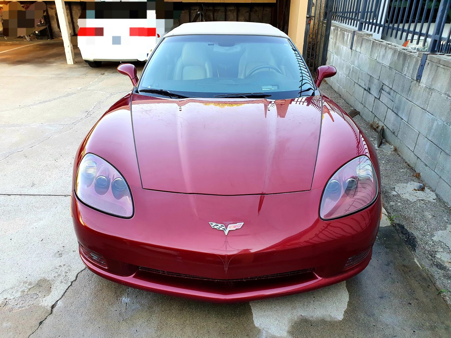 A Red Chevrolet Corvette With New Headlights