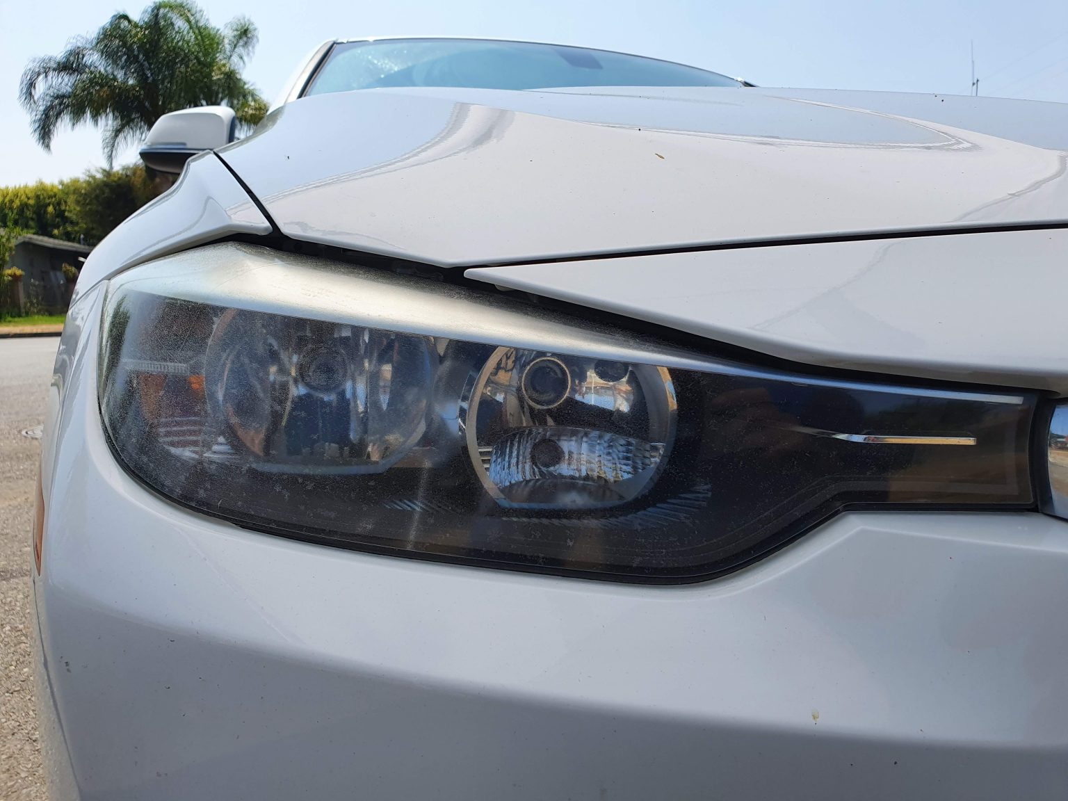 Front Headlights of a White BMW Car