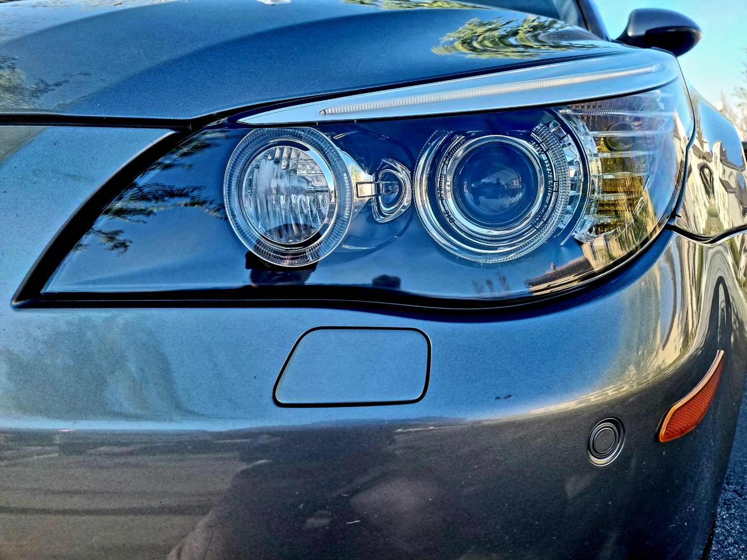 Front Side Headlights of a Grey Color Car