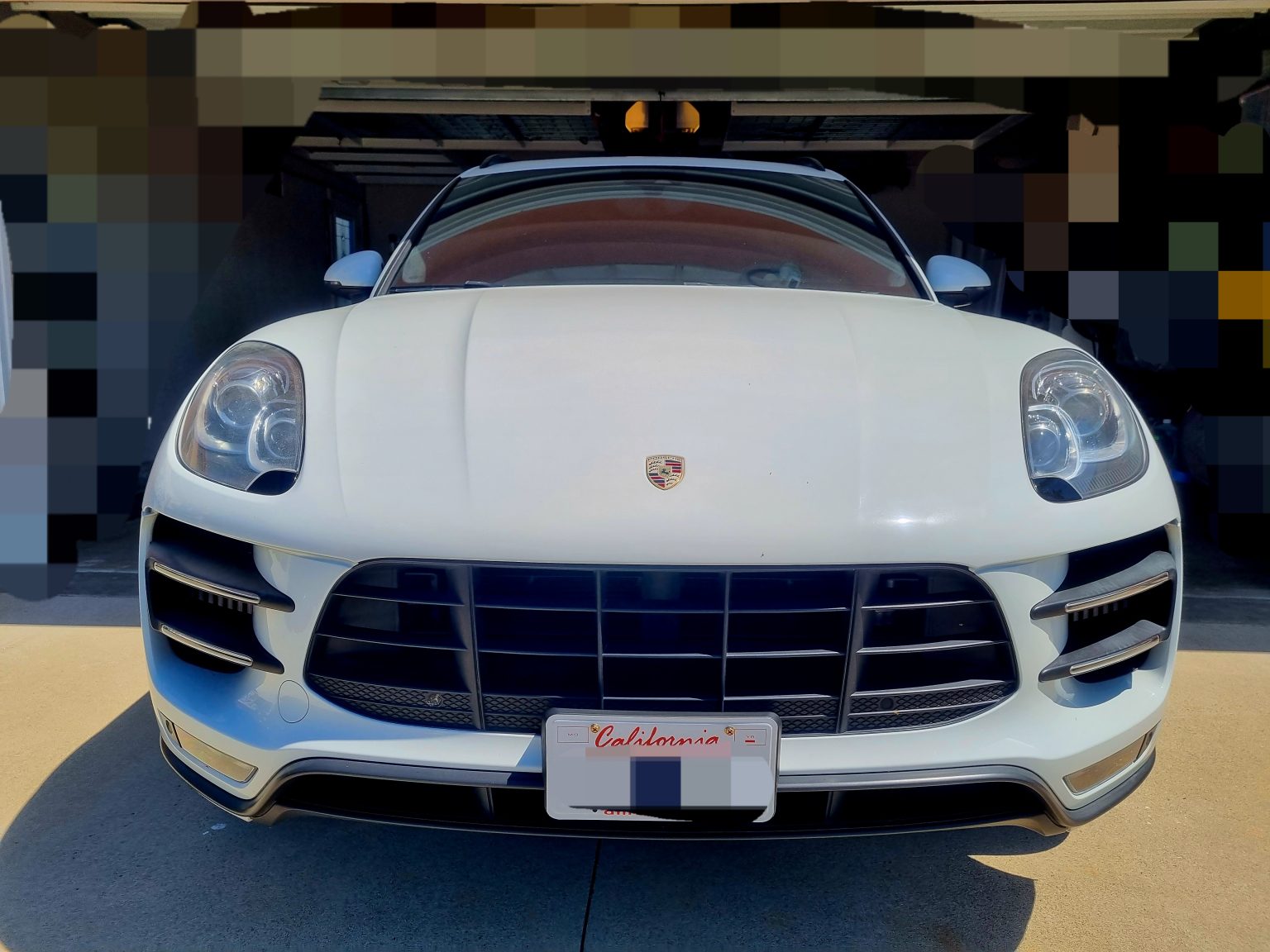 A White Color Porsche Car Front View