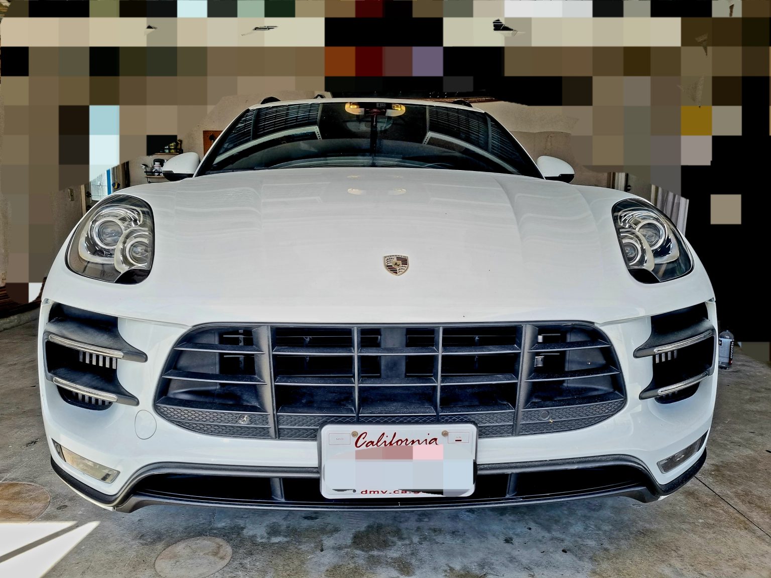 A White Color Porsche Car Front View Shot